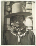 Navajo, Ganado, Arizona, wearing a string of turquoise he had purchased for $25.00.