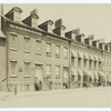 Block of five houses on Charlton St. near corner of Varick St., N.Y.