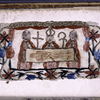 Embroidery, s. XVII?, of a bishop and two clerics holding up a shroud with the impression of Christ's body (suggested to be the Shroud of Besançon), [f. ii verso]