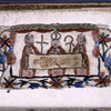 Embroidery, s. XVII?, of a bishop and two clerics holding up a shroud with the impression of Christ's body (suggested to be the Shroud of Besançon)