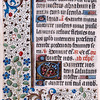 Page of text with rubrics, initials, linefillers and catchword.  Border design