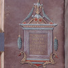 Purple folio with title in gold in elaborate frame