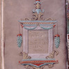 Purple folio with title in gold in elaborate frame