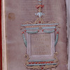 Purple folio with title in gold in elaborate frame
