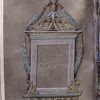 Purple folio with title in gold in elaborate frame