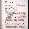 Page of text and music, with rubrics. Large black initial with interlace design and face of grotesque added