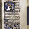 Historiated initial with the Archangel Michael; partial border, initial and rubrics