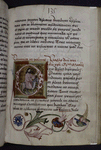 Historiated initial of Entry into Jerusalem.  Floral border, rubric, placemarkers
