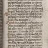 Text with rubrics, small pen flourishes, and quire signature