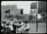 Corlear's Hook Park : girls around table in park, ca. 1910s