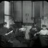 Fire house : men at Fire House No. 26 reading, July 29, 1910