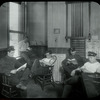 Fire house : men at Fire House No. 26 reading, July 29, 1910