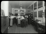 National Cloak & Suit Co. : people choosing books, 1916