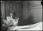 Post Graduate Hospital : boy reading Just so stories in bed, 1923