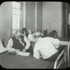 Post Graduate Hospital : one blind man reads braille to another, [Post Graduate library on label, possibly Blackwell's Island, see Photo/Branches]