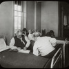 Post Graduate Hospital : one blind man reads braille to another, [Post Graduate library on label, possibly Blackwell's Island, see Photo/Branches]