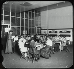 Young women around tables reading, P.S. 63, Recreation Center, May 1911