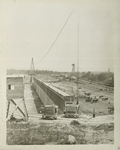 Ashokan Reservoir. View showing concrete core-wall of West dike with wooden forms in place. Placing and rolling embankment at right. Contract 3. June 21, 1910.