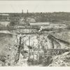 Kensico reservoir. General view of foundation and cut-off trench for Kensico dam and contractor's plant. Old dam at right of center and flume for controlling water of Bronx river. Contract 9. March 28, 1913.