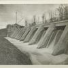 Kensico Influent Weir. Completed Influent weir and partially completed Influent chamber. Water flowing over weir into Knsico reservoir. Contract 55. December 6, 1915.