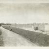 Hill View reservoir.  Uptake chamber and completed reservoir embankment showing concrete lining with dry-rubble masonry above, followed by top course of riprap. Contrac 30. May 12, 1915.