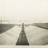 Silver Lake reservoir.  South Inlet channel lined with concrete looking towards gate-chamber in Middle dike. Contract 89. November 4, 1915.