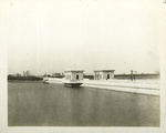 Silver Lake reservoir.  View showing Middle Dike roadway, parapets and gate-chambers. South basin in foreground. Contract 89 and 144. October 2, 1917.