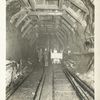 Rondout pressure tunnel. View showing completed excavation and roof timbering in place. Contract 12. July 20, 1909.