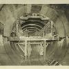 Rondout pressure tunnel. Steel arch forms mounted on traveler with plates removed to permit placing of concrete in haunches. Contract 12. October 10, 1910.