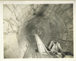 Yonkers pressure tunnel.  Finished lining in foreground. Placing concrete in side-walls and arch in background. ... Contract 54. May 1, 1912.