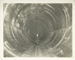 Yonkers pressure tunnel. Completed section of standard circular type of tunnel 16 feet 7 inches in diameter. Station-marking tile on left. Contract 54. November 21, 1913.