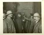 Organization. Hudson pressure tunnel. Mayor William J. Gaynor firing blast to connect East and West headings. In group, left to right, are Consulting Engineer John R. Freeman, Commissioner Charles Strauss, Chief Engineer J. Waldo Smith, Mayor Willian J. Gaynor and Commissioner John F. Galvin. Contract 90. January 30, 1912.