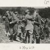 American soldiers learning to adjust gas masks under the direction of French instructors.