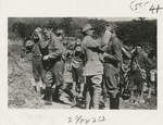 American soldiers learning to adjust gas masks under the direction of French instructors.