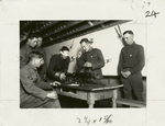 Student aviator assembling a Lewis gun blindfolded.