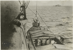 Mines being taken aboard a mine-layer.