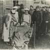 Nurses bidding goodbye to convalescent soldier.