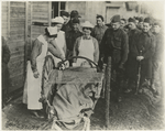 Nurses bidding goodbye to convalescent soldier.