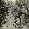 Troops resting in a trench.