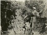 Troops resting in a trench.