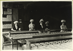 Group of women sorting chocolates