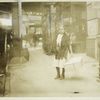 A young girl on West 3rd Street delivering flowers made at home during school hours