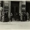 Group of women workers gathered outside the Dix Building, where they work on millinery