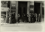 Group of women workers gathered outside the Dix Building, where they work on millinery