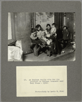 An Italian family sits for its portrait in Chicago tenement near Hull House, 1910
