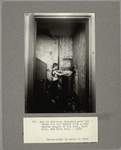 Boy in old-time tenement gets the water for his family from a community spigot in the hall, East Side, New York City, 1909
