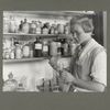 A third year high school girl in the chemical laboratory of a rural consolidated school, October 1921