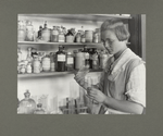 A third year high school girl in the chemical laboratory of a rural consolidated school, October 1921