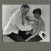 This boy is having a health examination to determine whether he is physically fit for work, June 1924