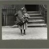 A small girl bringing homework to her tenement home, 1912